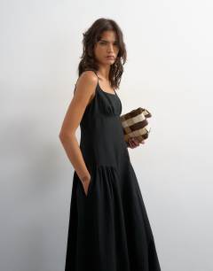 Model wearing Dropped waist maxi dress in black