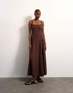 Model wearing Dropped waist maxi dress in chocolate