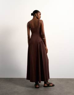 Model wearing Dropped waist maxi dress in chocolate