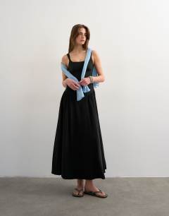 Model wearing Dropped waist maxi sundress in black