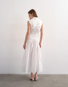 Model wearing Dropped waist sleeveless shirt dress in white