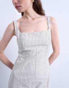 Model wearing Dropped waist woven stripe midi dress in mono