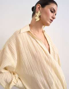 Model wearing Dropped waist wrap shirt dress in textured off white