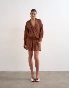 Model wearing Dropped waist wrap shirt dress in textured rust