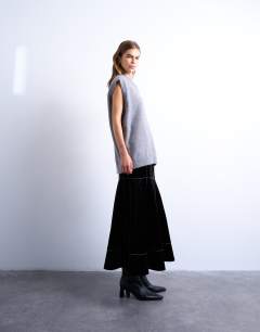 Model wearing Dropwaist contrast stitched PU maxi skirt in black