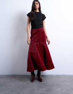 Model wearing Dropwaist contrast stitched PU maxi skirt in red