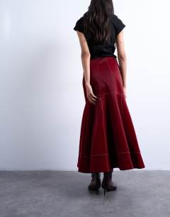 Model wearing Dropwaist contrast stitched PU maxi skirt in red
