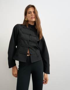 Model wearing Drummer jacket with detailing in black
