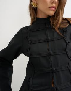 Model wearing Drummer jacket with detailing in black