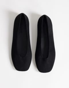Model wearing Duke faux suede chiselled ballet flat in black