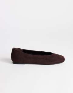 Model wearing Duke faux suede chiselled ballet flat in chocolate