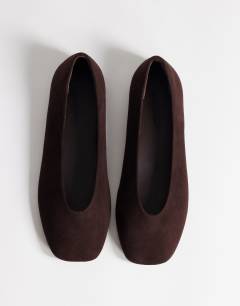 Model wearing Duke faux suede chiselled ballet flat in chocolate