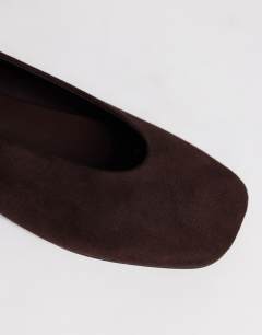 Model wearing Duke faux suede chiselled ballet flat in chocolate