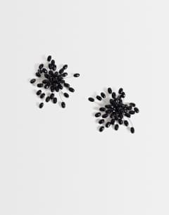 Model wearing Echo statement hand-made stud earring in black