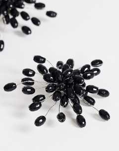 Model wearing Echo statement hand-made stud earring in black