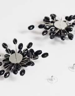 Model wearing Echo statement hand-made stud earring in black