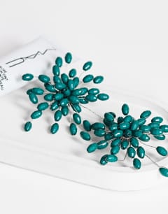 Model wearing Echo statement hand-made stud earring in dark green