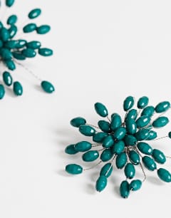 Model wearing Echo statement hand-made stud earring in dark green