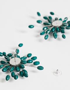 Model wearing Echo statement hand-made stud earring in dark green