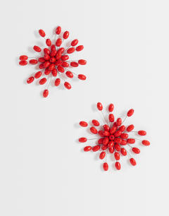Model wearing Echo statement hand-made stud earring in red