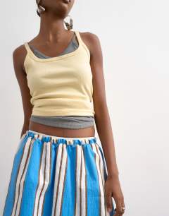 Model wearing Elasticated mini skirt in sporty blue stripe