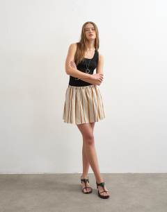 Model wearing Elasticated mini skirt in sporty rust stripe