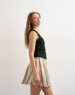 Model wearing Elasticated mini skirt in sporty rust stripe