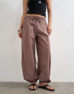 Model wearing Elasticated waist cuffed hem techy trouser in brown