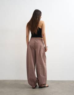 Model wearing Elasticated waist cuffed hem techy trouser in brown
