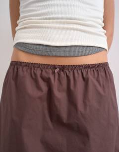 Model wearing Elasticated waist lace petticoat mini skirt in chocolate