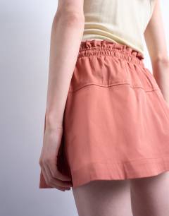 Model wearing Elasticated waist mini skort in rust