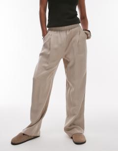 Model wearing Elasticated waistband tailored jogger trouser in stone