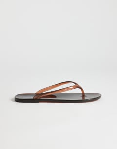 Model wearing Elias jelly flip flop in brown