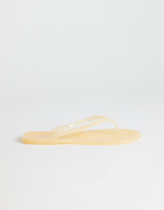 Model wearing Elias jelly flip flop in buttermilk