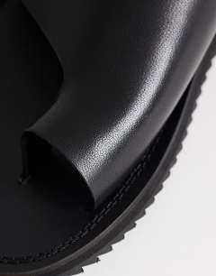 Model wearing Ella leather toe loop sandal in black