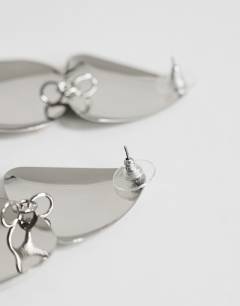 Model wearing Elliot statement stud earring in silver brushed