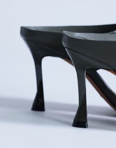 Model wearing Elodie toe thong heeled mule in khaki