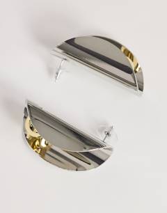 Model wearing Eloise statement stud earrings in silver and gold