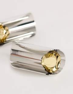 Model wearing Eloise statement stud earrings in silver and gold