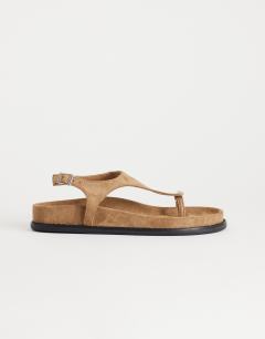 Model wearing Elsie hardware footbed sandal in taupe faux suede 