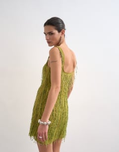 Model wearing Embellished fringing mini dress in green