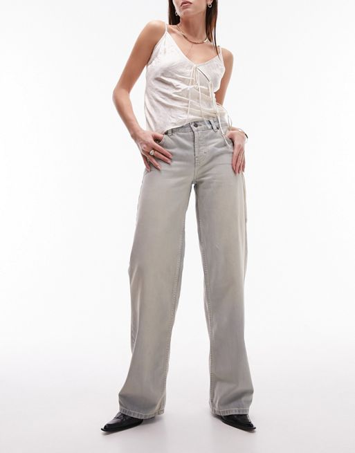 Topshop - Ember - Jeans met wijde pijpen en lage taille in vuile bleekwassing