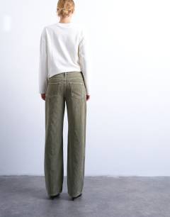 Model wearing Ember low rise cord jean in sage