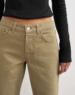 Model wearing Ember low rise relaxed straight jean in sand