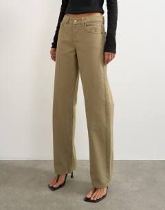 Model wearing Ember low rise relaxed straight jean in sand