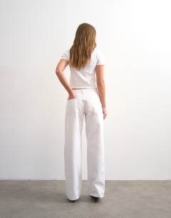 Model wearing Ember low rise relaxed straight jean in white - WHITE