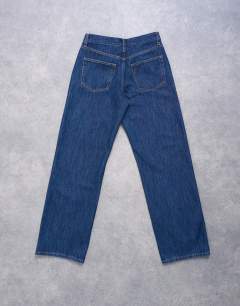 Model wearing Ember low rise relaxed straight leg jean in indigo rinse