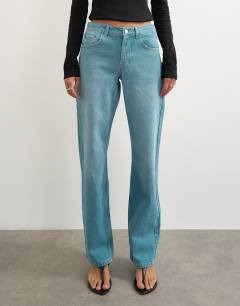 Model wearing Ember low rise relaxed straight leg jean in teal