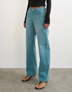 Model wearing Ember low rise relaxed straight leg jean in teal