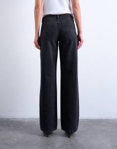 Model wearing Ember low rise relaxed straight leg jean in washed black